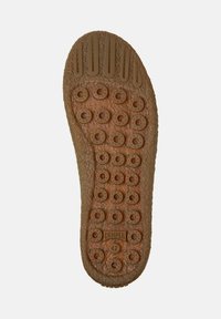 Sole of a brown shoe with circular textured grips, vertical grooves near the toe, and "Camper" logo with size 42 at the heel.