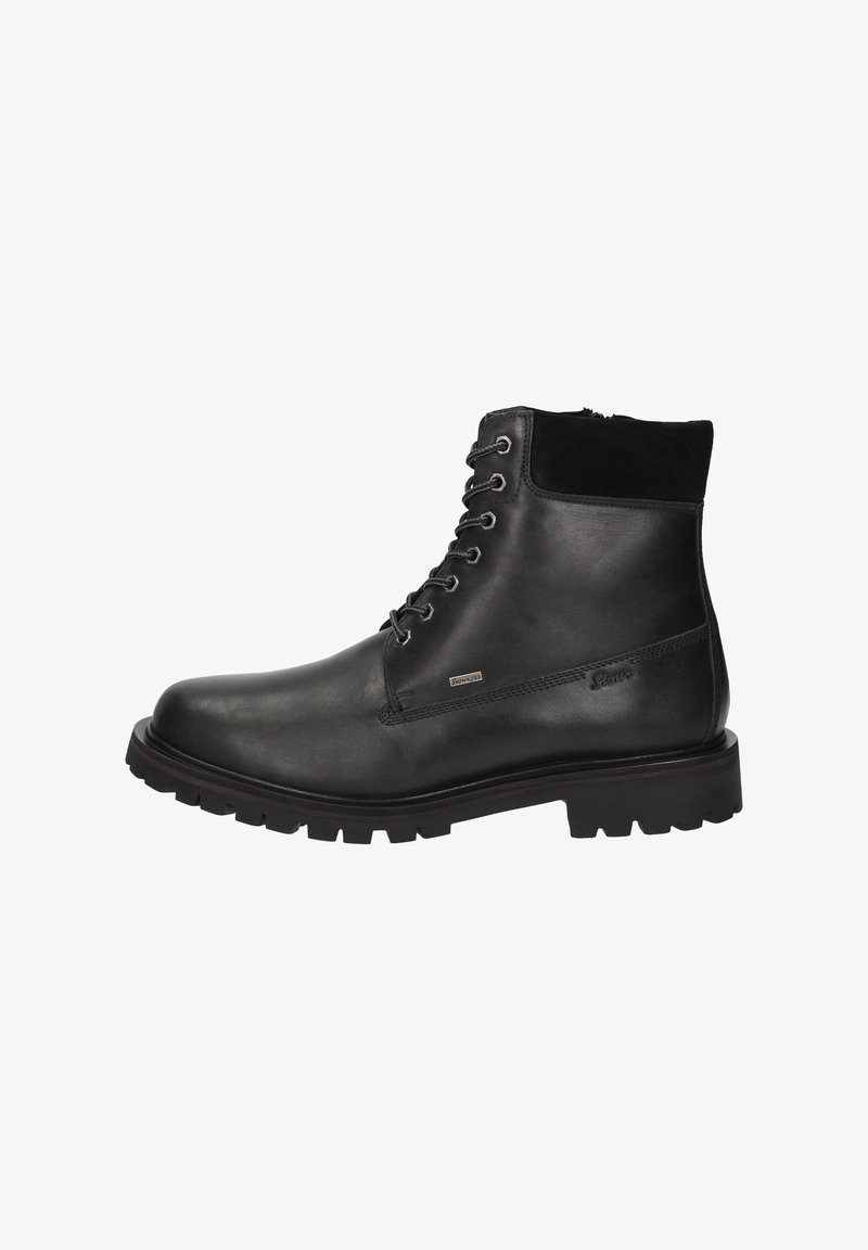 Stivali alla caviglia in pelle nera con colletto in camoscio testurizzato, punta rotonda e suola in gomma robusta. Presentano occhielli in metallo e design con lacci.