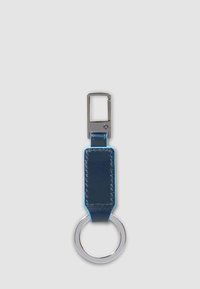 Blue leather keychain with silver metal ring and rectangular clip on light gray background.