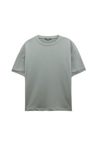 Lys grøn, t-shirt med korte ærmer lavet af blød bomuld, med rund halsudskæring og løs pasform, samt subtile tekstur- og syningsdetaljer.