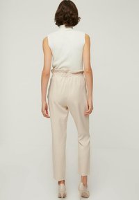 Trendyol Kalhoty - beige