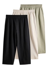 Tre paia di pantaloni: nero, beige e verde oliva. Tutti con cintura elastica, tessuto morbido e design rilassato e affusolato.