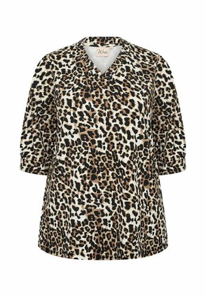 Leoparda raksta tops ar mīkstu, teksturētu audumu. Ir V veida kakla izgrieziens un īsas pūkainas piedurknes, brūnu, melnu un krēma toņu kombinācijā.