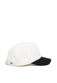 Baseball cap with a white body and black brim. Features a textured finish and adjustable strap with logo accent at the back.