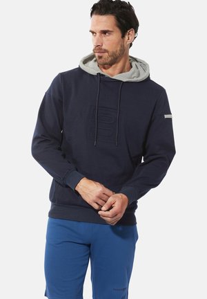 Marineblauer Kapuzenpullover mit grauem Innenfutter, mit einem strukturierten Logo auf der Vorderseite, Kordelzügen und gerippten Bündchen und Saum.