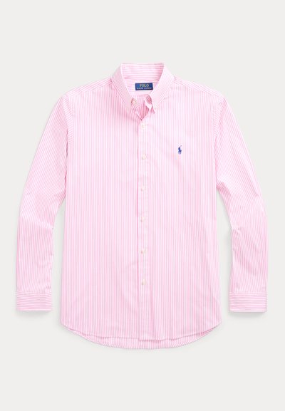 Πουκάμισο με μακριά μανίκια και κουμπιά, ριγέ σε ροζ και λευκό. Διαθέτει κλασικό γιακά, μία τσέπη στο στήθος με λογότυπο και τυπικά μανσέτες.