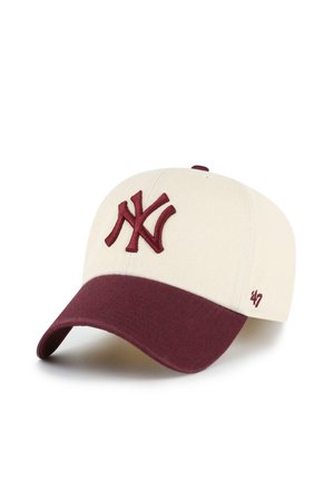 Off-white baseball cap with a maroon brim and embroidered "NY" logo on front, and small '47' logo on side.