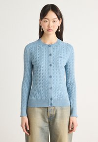 Light blue cable-knit cardigan with ribbed cuffs and hem, featuring six buttons down the front and a small logo on the left chest.