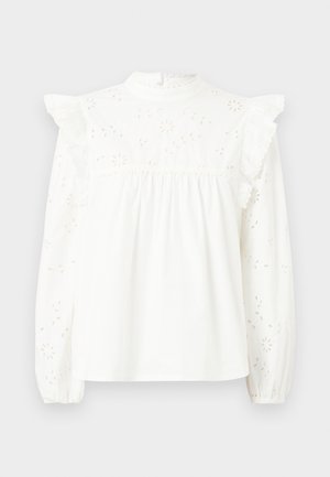 Vit bomullsskjorta med långa ärmar, volangdetaljer på axlarna, spetskanter och blommönsterbroderier på fram- och ärmar.