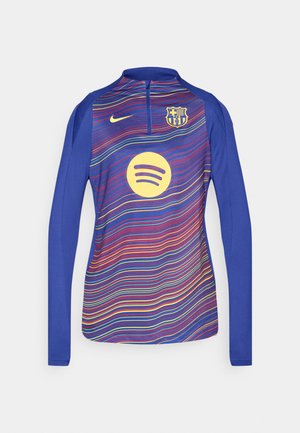 Langärmliges blaues Trikot mit halbem Reißverschluss, das ein Wellenmuster in Rot, Gelb und Violett zeigt. Enthält ein gelbes Spotify-Logo.