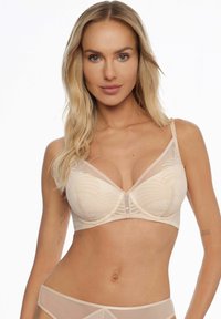 Jasnobeżowy biustonosz o wzorzystym fasonie z przezroczystymi siateczkowymi panelami. Posiada regulowane ramiączka oraz zapięcie na klamrę z przodu.