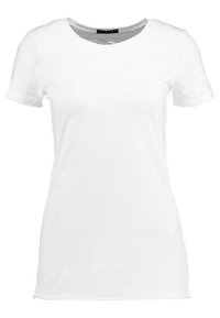 Bílé tričko s krátkým rukávem vyrobené z měkké, lehké látky. Má kulatý výstřih a volný střih s hladkým povrchem.