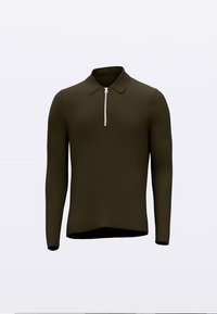 Tumesalvavärvi pika varrukaga polosärk, millel on lukk kaelaosas, tekstureeritud kangas ja istuv disain veidi kaardus äärega.