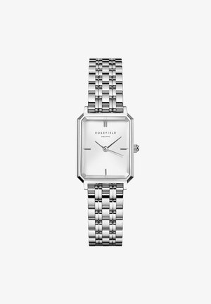 Montre rectangulaire argentée avec un bracelet en maillons métalliques, un cadran blanc texturé et des index horaires minimalistes. Le nom de la marque "ROSEFIELD" est affiché.