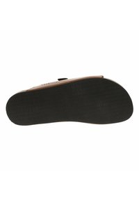 Scarpa marrone senza lacci con suola in gomma testurizzata, forma arrotondata e tomaia in pelle liscia, dotata di una chiusura con strap in velcro.