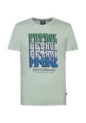 Light green short-sleeve t-shirt featuring a bold graphic with the word "PETROL" in varying shades of blue and green, palm tree accents.