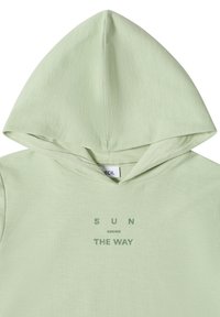 Light green hoodie with the phrase "SUN KNOWS THE WAY" printed in green on the front below the hood.