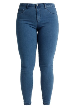 Dżinsy o wysokim stanie, slim fit w średnim niebieskim denimenie. Klasyczny fason pięciu kieszeni z metalowym guzikiem i zapięciem na zamek. Gładka tekstura.