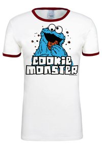 White T-shirt with red-rimmed collar and sleeves, featuring a graphic of Cookie Monster eating a cookie and the text "COOKIE MONSTER" below.
