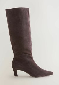 Dark brown suede knee-high boot with a pointed toe and a modest block heel. Smooth texture, sleek design, minimal stitching details.