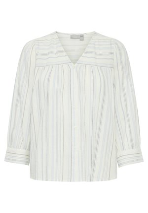 Valge särk, millel on vertikaalsed sinised triibud, V-kaelus, pikad varrukad nööpidega mansettidega ja veidi lõtv sobivus.