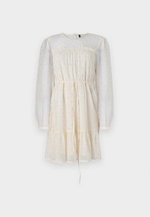 Cream dress with long, sheer puff sleeves, a gathered bodice, and a tiered skirt. Features subtle silver accents and a drawstring waist.