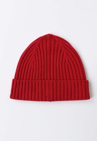 Red ribbed knit beanie with a folded cuff. Made of soft, textured fabric, featuring vertical stripes and a seamless top design.