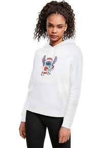 Hoodie bianca con tasca frontale che presenta un'illustrazione di un personaggio in costume da Babbo Natale. Tessuto morbido, vestibilità rilassata, cappuccio con cordino.