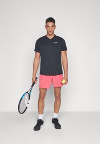 Nike Performance Sportiniai šortai - aster pink/black
