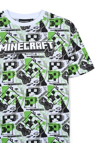 T-shirt a maniche corte con un motivo di Minecraft in verde, nero e bianco, caratterizzato da forme geometriche, colletto a girocollo e un design del logo audace.