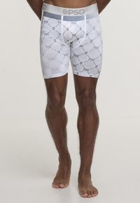 White PSD boxer briefs featuring a mesh pattern, gray waistband, and repeated number "12" pattern. Short length and fitted design.