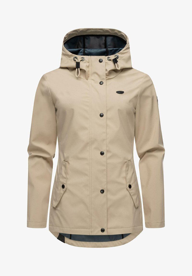 Beige waterproof jacket with a fitted hood, black buttons, and two side pockets. Features accent stitching and a slightly longer back.