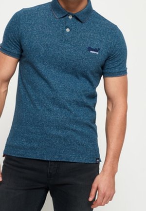 Short-sleeve polo shirt in textured blue fabric. Features a collar, two buttons, and a small logo on the left chest.