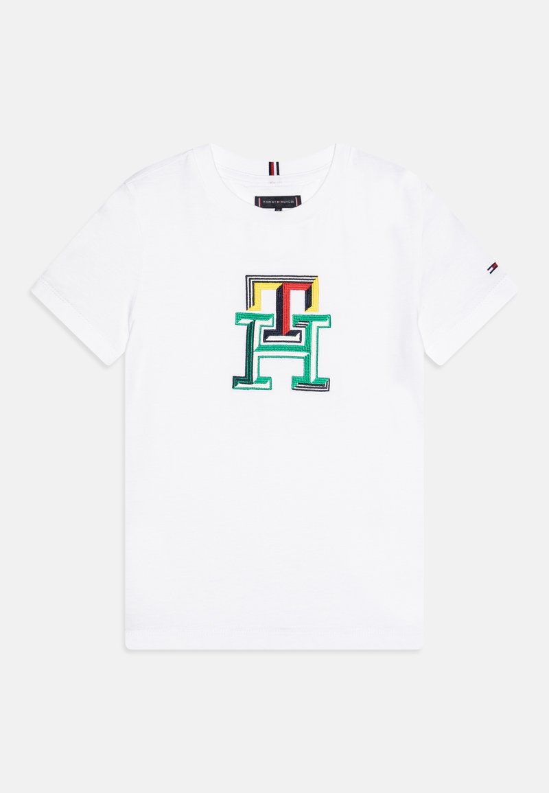 Hvid bomulds-T-shirt med flerfarvet broderet "H"-logo med konturer i grøn, gul, rød og sort. Korte ærmer, rund hals.
