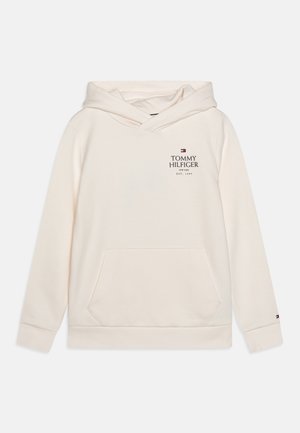 Sudadera con capucha de color beige claro, fabricada con un material suave. Cuenta con un bolsillo frontal, impresión de logo y puños acanalados. Diseño sencillo con un ajuste relajado.