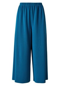 Culottes larges teal en tissu côtelé avec une taille élastique, offrant une coupe ample et une longueur jusqu'aux chevilles.