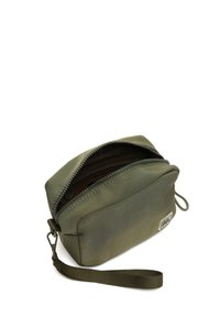 Olive green zippered pouch made of soft fabric, featuring a flat rectangular shape, a wrist strap, and a small logo on the front.