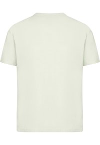 Light green cotton t-shirt with a round neckline, short sleeves, and a straight cut. Plain design, no visible patterns or logos.