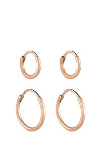 Örhängen i roséguld med hoops i två storlekar: små och stora. Slät yta, cirkulär form, säker låsning. Enkel design utan ytterligare dekorationer.