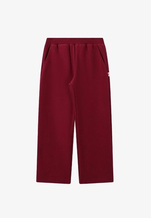 Pantalons larges bordeaux avec taille élastique et poches latérales, fabriqués en tissu doux et texturé.