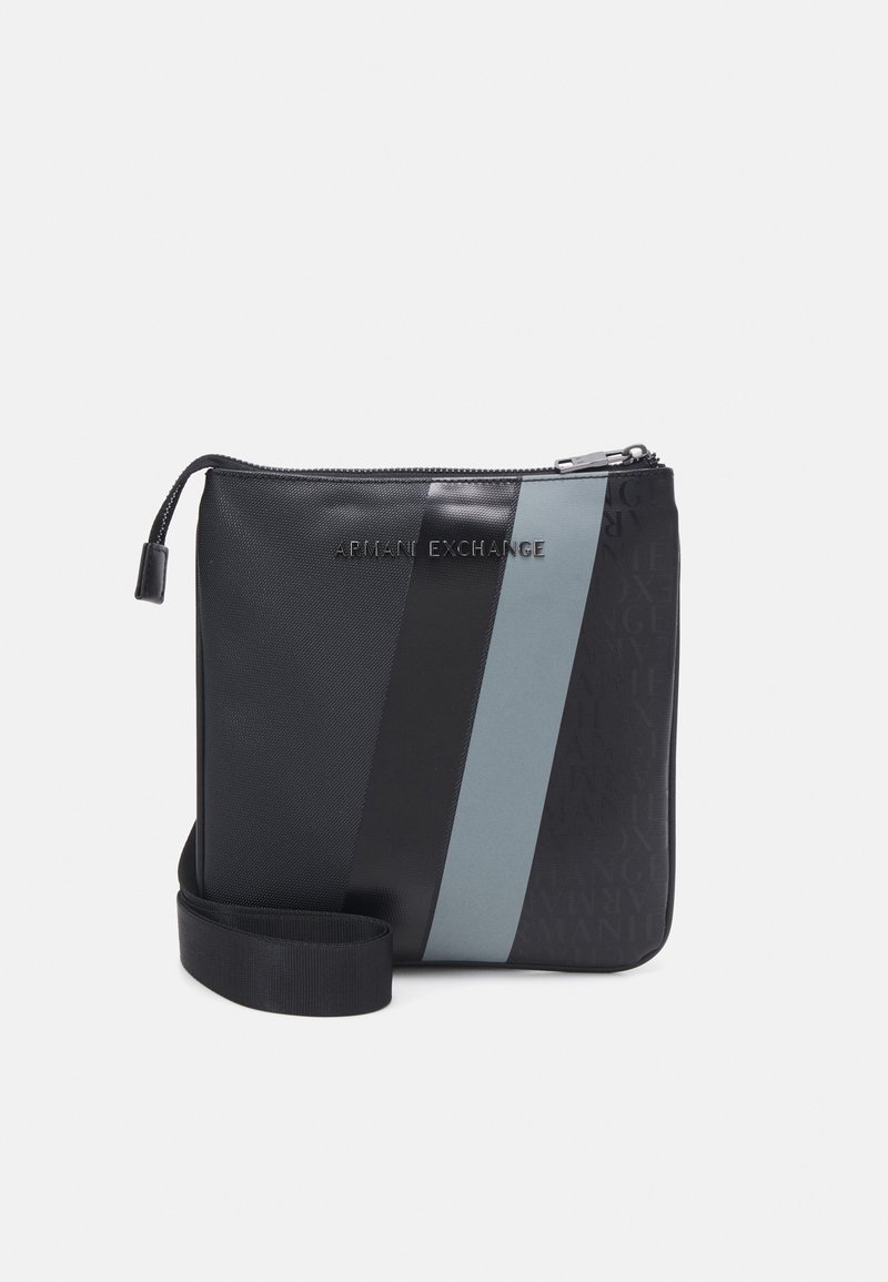 Black and gray synthetic crossbody bag with a patterned texture, featuring a zip closure, adjustable strap, and embossed branding.