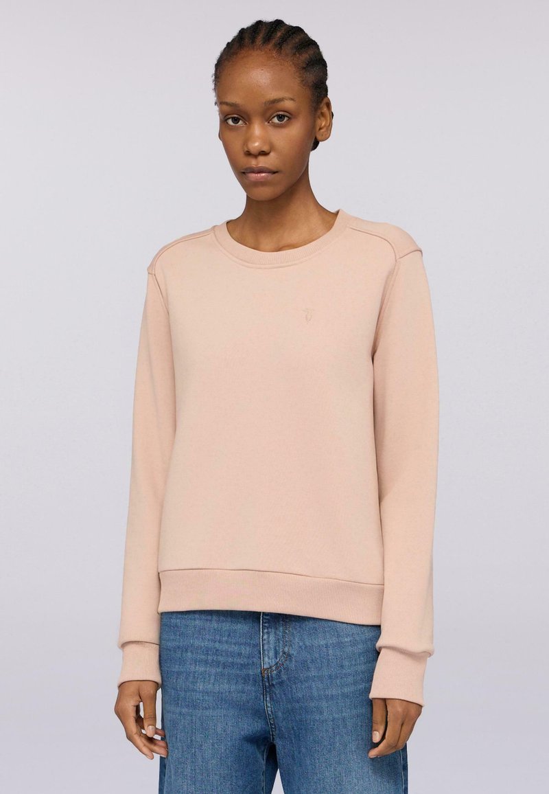 Sudadera rosa hecha de una tela suave, con un cuello redondo y puños acanalados. Presenta un logo sutil en el pecho y un corte relajado.