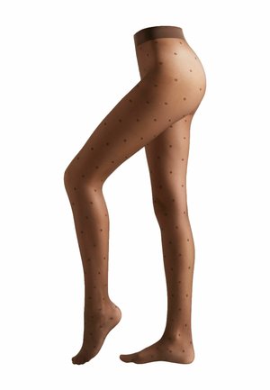 Collants nude transparents avec des pois bruns, dotés d'une taille haute et d'une texture lisse, conçus pour s'ajuster étroitement autour de la jambe.