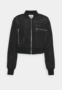 Black cropped bomber jacket made of smooth material, featuring a front zipper, two zippered chest pockets, and ribbed cuff and hem details.