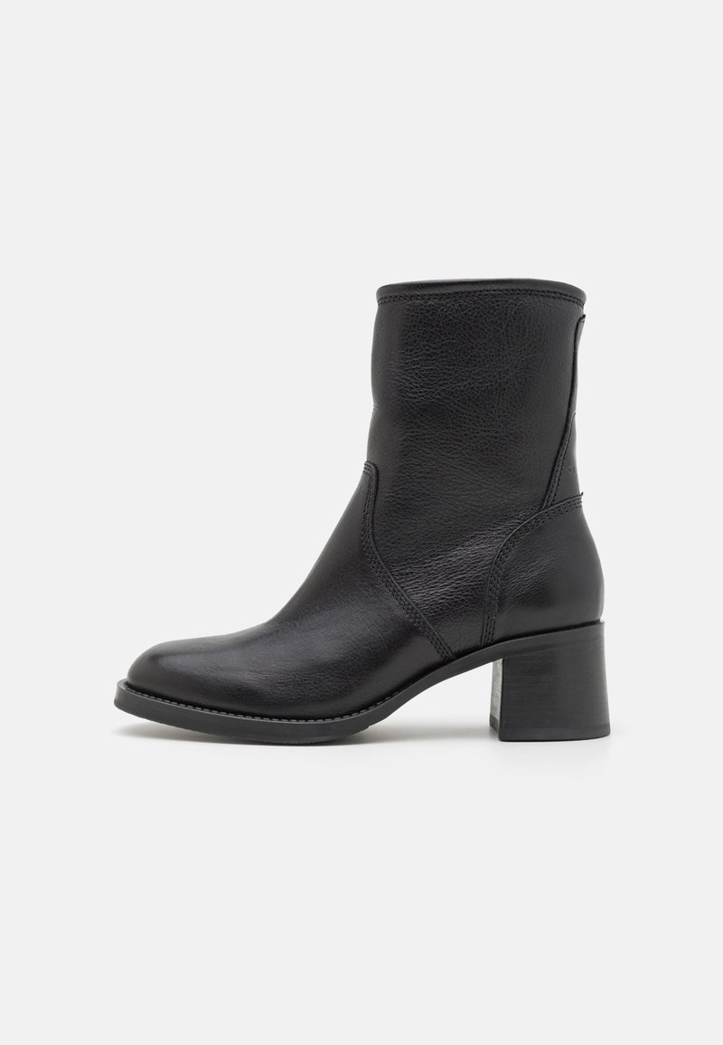 Black leather ankle boot with a rounded toe and a mid-height block heel. Features a smooth texture and minimal stitching detail.