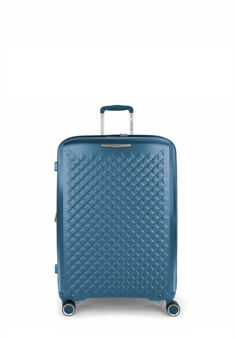 Valigia rigida blu con motivo a rombi, manico telescopico e quattro ruote per la mobilità. Superficie liscia, design robusto e forma compatta.