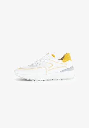 White sneaker with yellow suede accents and grey heel. Features stitching details and lace-up design. Textured sole for traction.