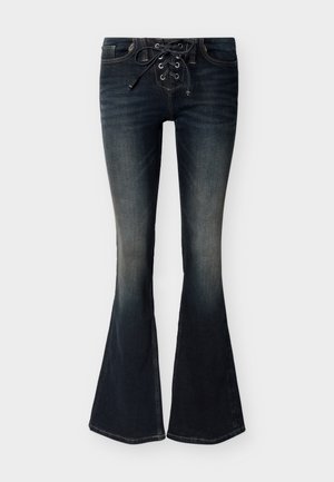 Dunkelblau gefärbte Denim-Flared-Jeans mit vorderer Schnürung und dezenten Verblassungen an Oberschenkeln und Knien.