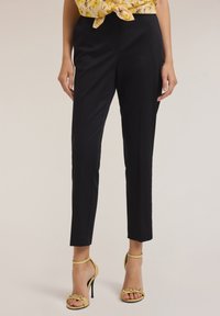 REGULAR - Pantaloni - nero