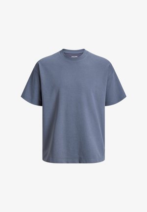 T-shirt bleu uni à manches courtes, col rond, coupe décontractée et petite étiquette blanche avec logo à l’intérieur du col.